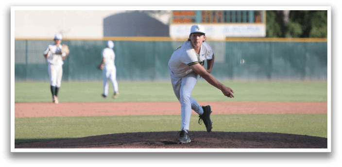 A baseball player in a white uniform is pitching a ball on a field. Description generated by AI