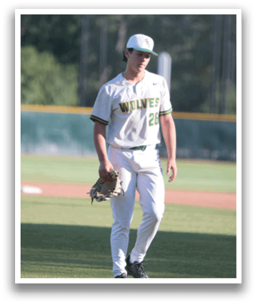 A baseball player wearing a white and green uniform. Description generated by AI