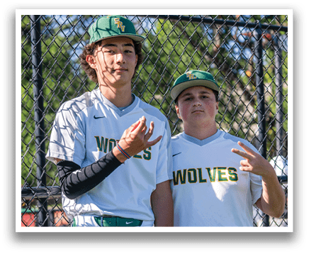 Two baseball players wearing white uniforms and green belts. Description generated by AI