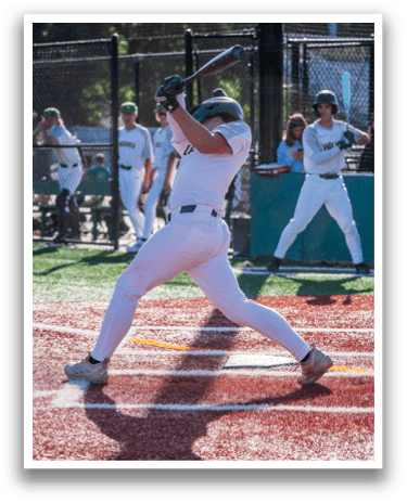 A baseball player is swinging a bat at a ball. Description generated by AI