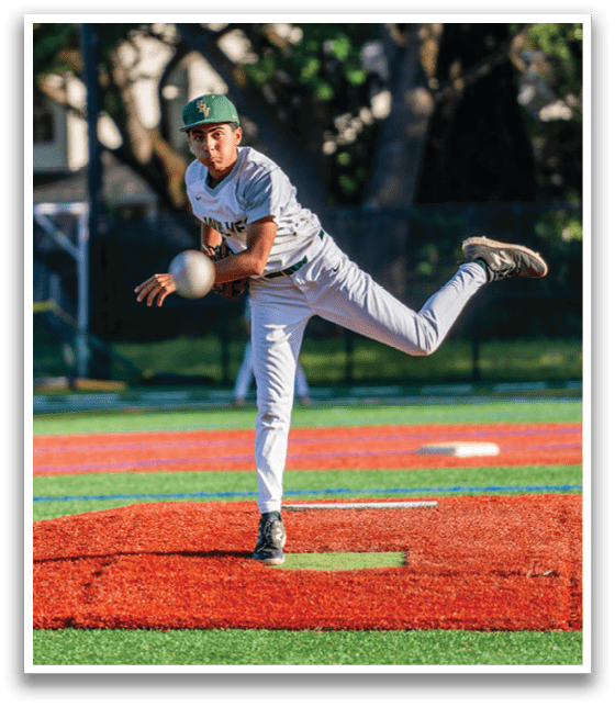 A baseball player in a green hat and white uniform is pitching a ball. Description generated by AI