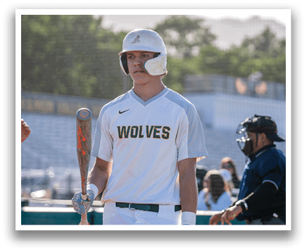 A baseball player holding a bat. Description generated by AI