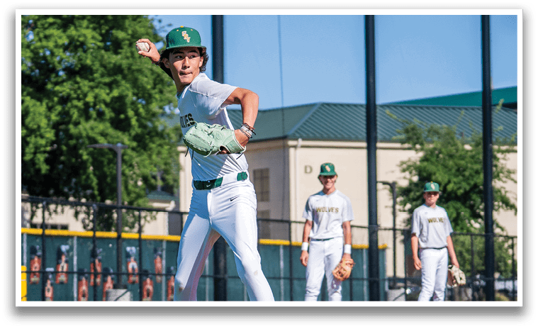 A baseball player in a white uniform is pitching a ball. Description generated by AI