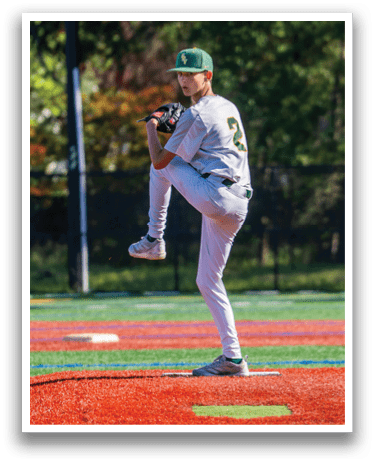 A baseball player in a grey uniform with the number 2 on it is in the process of throwing a ball. Description generated by AI