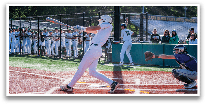 A baseball player is swinging a bat at a ball. Description generated by AI