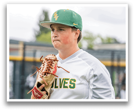A baseball player wearing a green and yellow hat and a white shirt. Description generated by AI