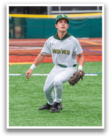 A baseball player wearing a grey and white uniform with the word wolves on the front. Description generated by AI
