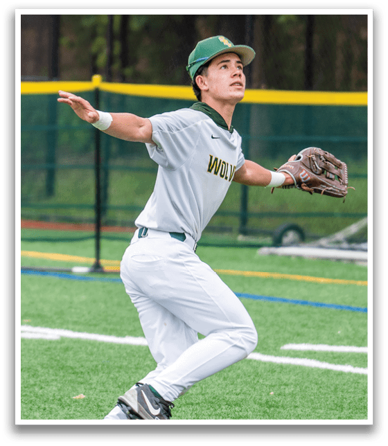 A baseball player wearing a green hat and white uniform catching a ball. Description generated by AI