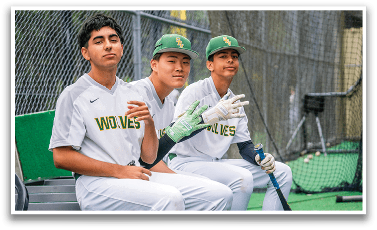 Two baseball players sitting on a bench. Description generated by AI