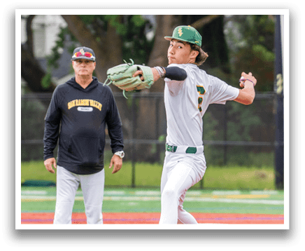 A man in a white uniform is pitching a baseball. Description generated by AI