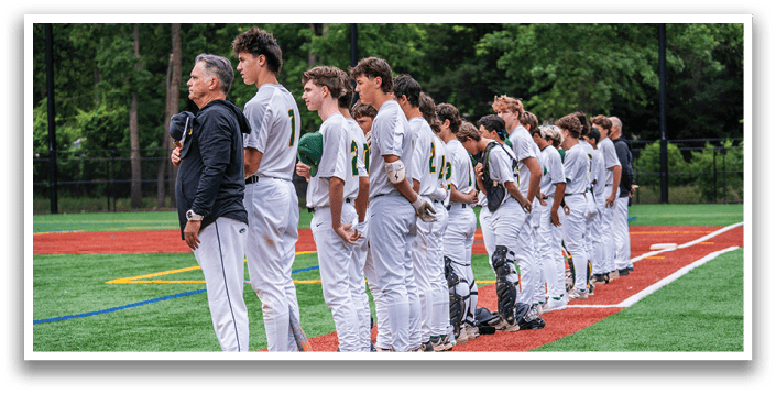 A group of baseball players standing on a field. Description generated by AI