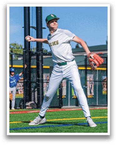 A baseball player in a white uniform is pitching a ball. Description generated by AI