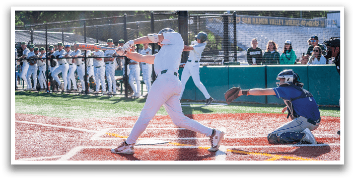 A baseball player is swinging a bat at a ball. Description generated by AI