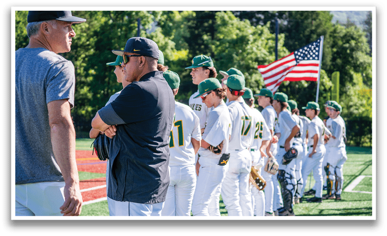 A group of baseball players wearing green and yellow uniforms. Description generated by AI