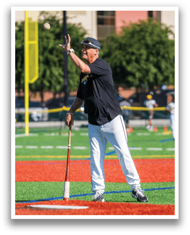 A man holding a baseball bat on a baseball field. Description generated by AI