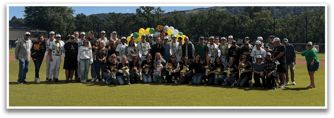 A group of people posing for a picture on a baseball field. Description generated by AI