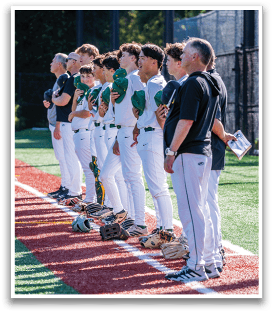 A group of baseball players standing on a field. Description generated by AI