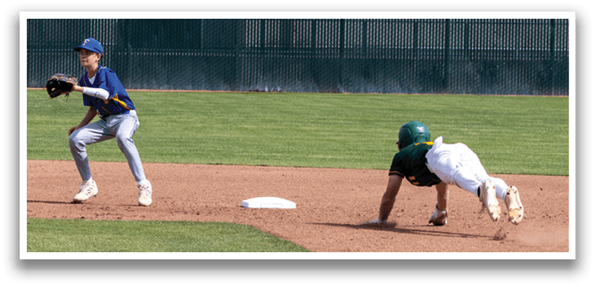 A baseball player slides into a base. Description generated by AI