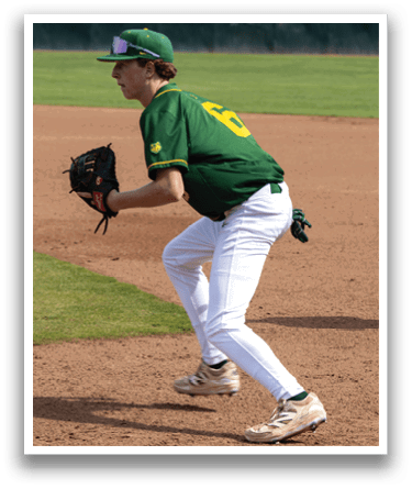 A baseball player wearing a green and yellow jersey and white pants. Description generated by AI