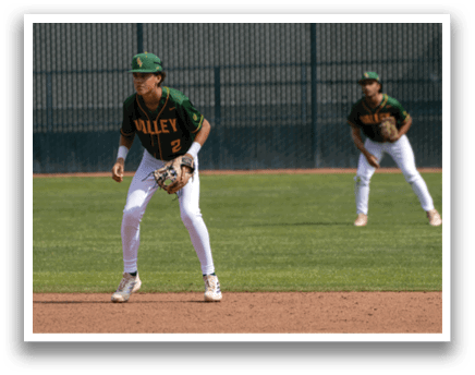 A baseball player wearing a green and yellow jersey. Description generated by AI