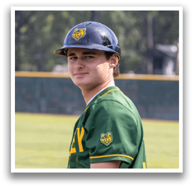 A baseball player wearing a green and yellow jersey. Description generated by AI