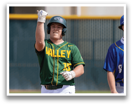 A baseball player wearing a green and yellow jersey with the number 15 on it. Description generated by AI