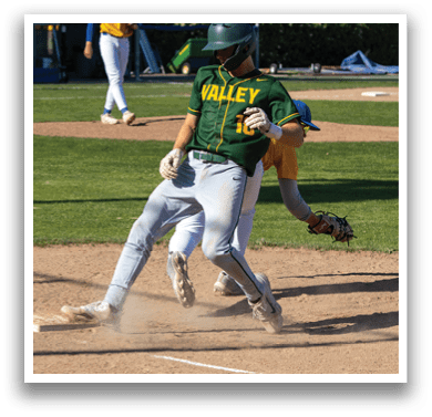 A baseball player sliding into a base. Description generated by AI