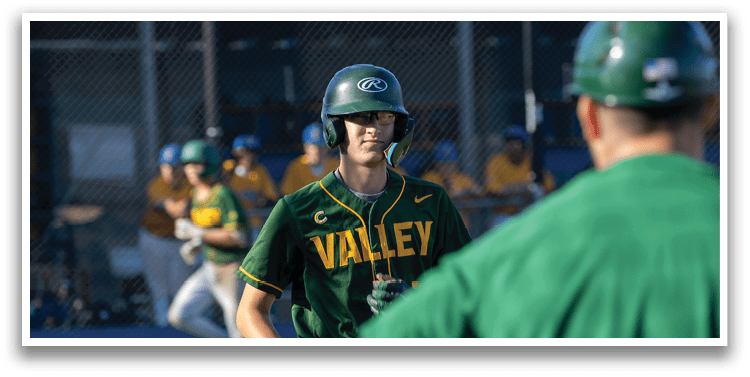 A baseball player wearing a green and yellow jersey. Description generated by AI
