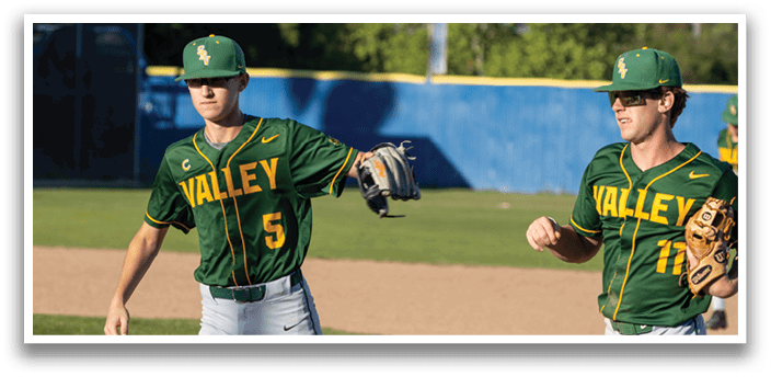 Two baseball players wearing green and yellow jerseys. Description generated by AI