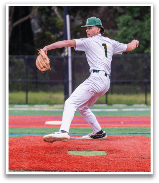 A baseball player in a white uniform is pitching a ball. Description generated by AI