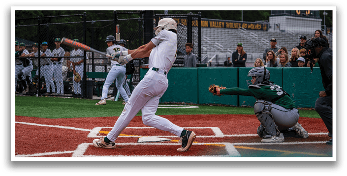 A baseball player is swinging a bat at a ball. Description generated by AI
