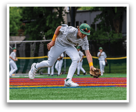 A baseball player catching a ball. Description generated by AI