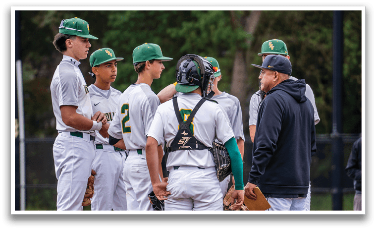 A group of baseball players wearing white uniforms and green and yellow shirts. Description generated by AI