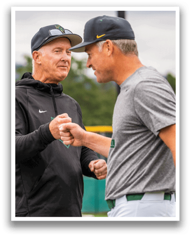 Two men shaking hands. Description generated by AI