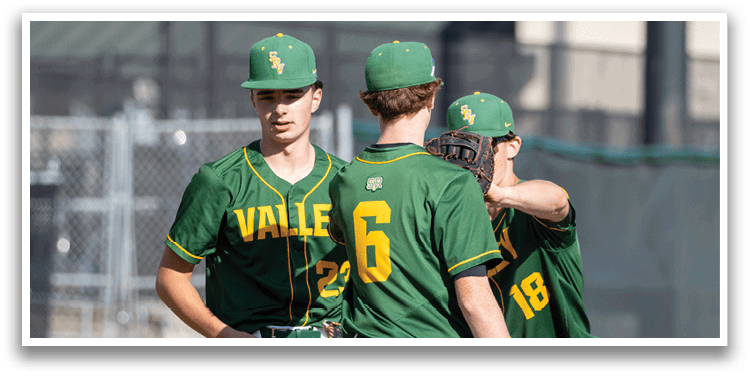 Three baseball players wearing green and yellow uniforms. Description generated by AI