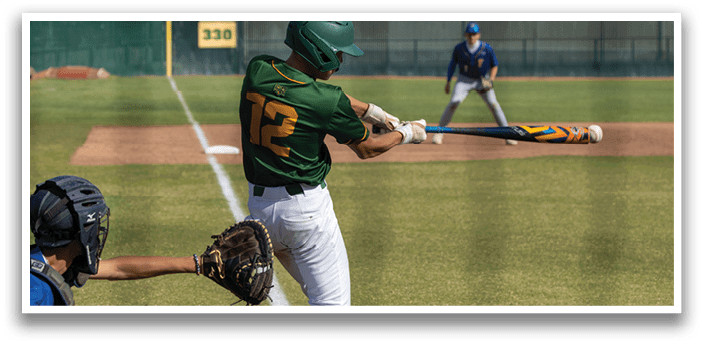 A baseball player in a green and yellow uniform is swinging a bat. Description generated by AI
