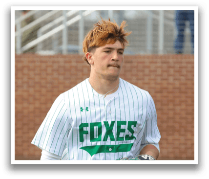 A baseball player wearing a white and green uniform is walking on the field. Contenido generado con IA