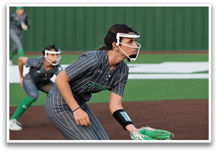 A female baseball player wearing a helmet and catcher's mitt, ready to catch the ball. Contenido generado con IA