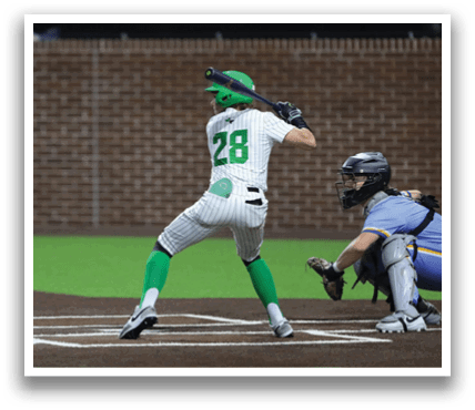 A baseball player in a green helmet is swinging a bat at a ball. Contenido generado con IA