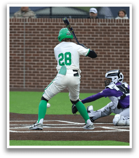 A baseball player in a green and white uniform is swinging a bat at a ball. Contenido generado con IA