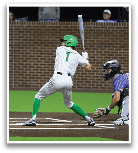 A baseball player in a green and white uniform is swinging a bat at a ball. Contenido generado con IA
