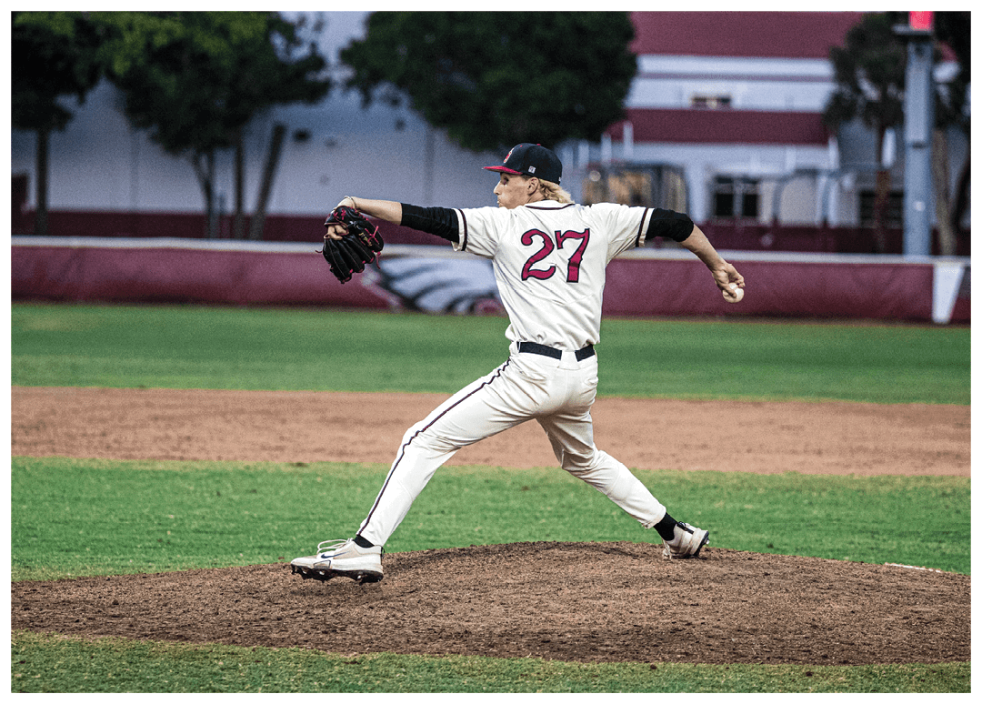 A baseball player wearing a white and red uniform is pitching a ball. Description generated by AI