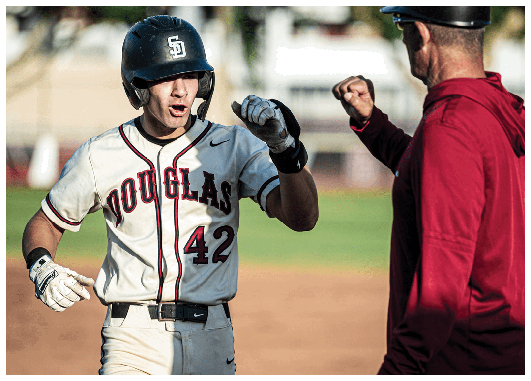 A baseball player wearing a black helmet and jersey with the number 42 on it. Description generated by AI
