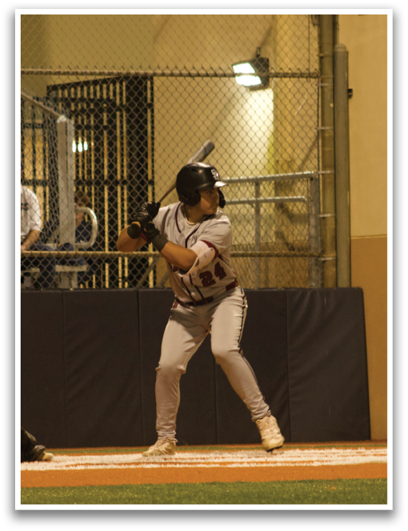 A baseball player is at bat, holding a bat and preparing to swing. The catcher and umpire are positioned behind him, ready for the play. AI generated content