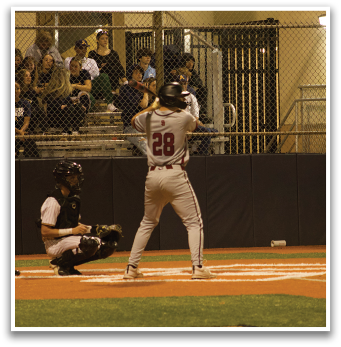 A baseball player is at bat, holding a bat and waiting for the pitch. AI generated content