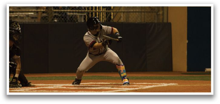 A baseball player is swinging a bat at a ball during a game. AI generated content