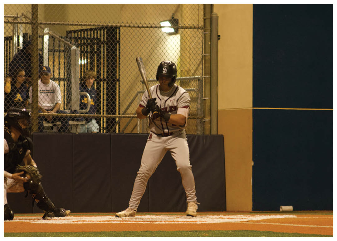 A baseball player is holding a bat, ready to swing at an incoming pitch. AI generated content