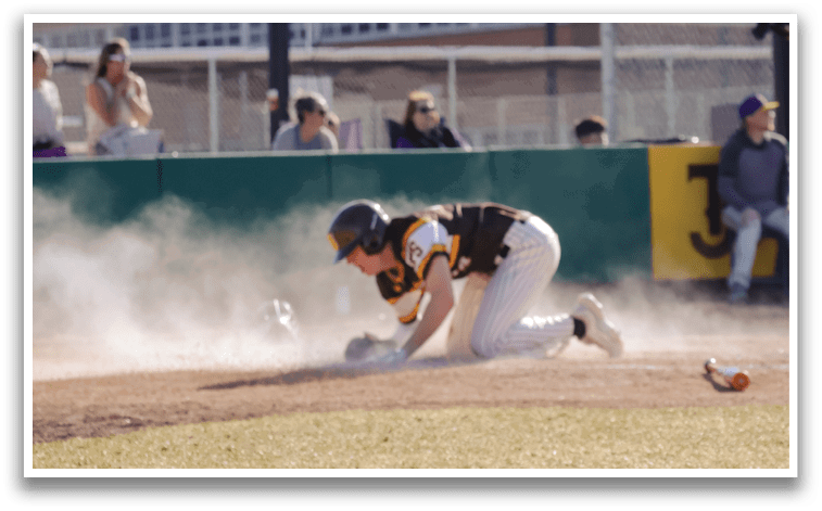 A baseball player slides into a base, kicking up dust. AI generated content