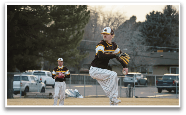 Two men are playing baseball. One man is a pitcher, and the other is a catcher. The pitcher is in the process of throwing the ball. AI generated content