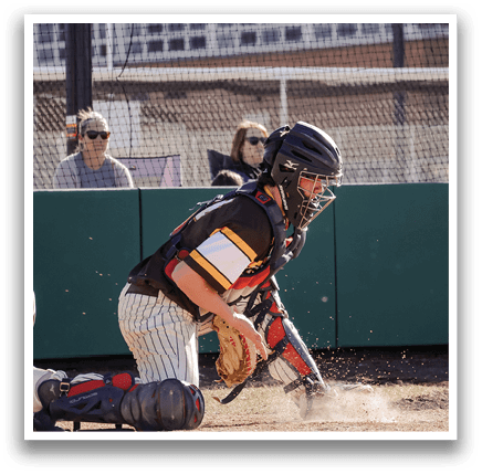 A baseball player is kneeling on the ground, wearing a catcher's mitt, and preparing to catch a ball. AI generated content